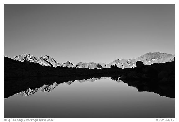 Mountain range reflected in calm lake, Dusy Basin. Kings Canyon National Park (black and white)