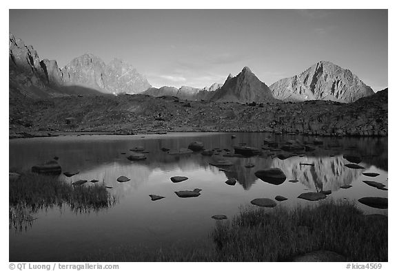 Mt Thunderbolt, Isoceles Peak, and Palissades reflected in a lake in Dusy Basin, sunset. Kings Canyon National Park, California, USA.