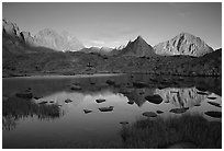 Mt Thunderbolt, Isoceles Peak, and Palissades reflected in a lake in Dusy Basin, sunset. Kings Canyon National Park, California, USA. (black and white)