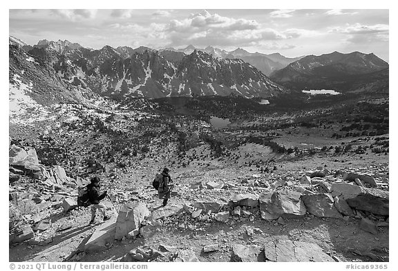 Women hikers descend trail from Kearsarge Pass. Kings Canyon National Park (black and white)