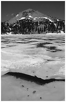 Ice break up in lake Helen and Lassen Peak, early summer. Lassen Volcanic National Park, California, USA. (black and white)