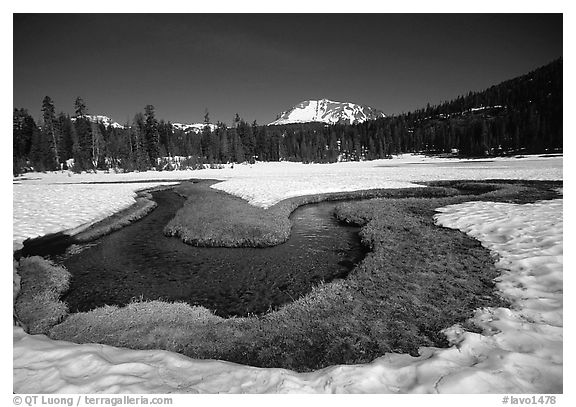 Stream in partly snow-covered Kings Creek meadows, morning. Lassen Volcanic National Park, California, USA.