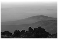 Ridges and volcanic rocks from  summit of Lassen Peak, sunset. Lassen Volcanic National Park, California, USA. (black and white)