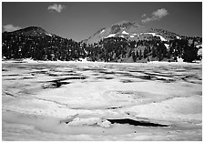 Helen Lake with Ice breaking up, and Lassen Peak. Lassen Volcanic National Park, California, USA. (black and white)