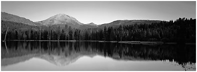 Lassen Peak reflected in Manzanita lake at sunset. Lassen Volcanic National Park (Panoramic black and white)