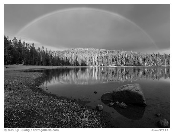 Rainbow in dark sky above Juniper Lake. Lassen Volcanic National Park (black and white)