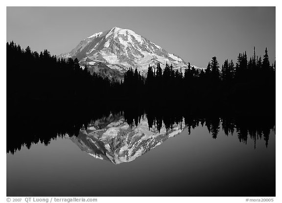 Mount Rainier with calm reflection in Eunice Lake, sunset. Mount Rainier National Park, Washington, USA.