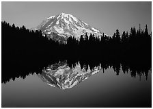 Mount Rainier with calm reflection in Eunice Lake, sunset. Mount Rainier National Park, Washington, USA. (black and white)