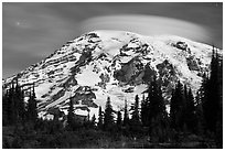 Mount Rainier capped by lenticular cloud, night. Mount Rainier National Park, Washington, USA. (black and white)