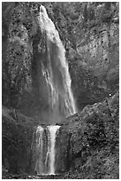 Hiker in the distance gives scale to Comet Falls. Mount Rainier National Park ( black and white)