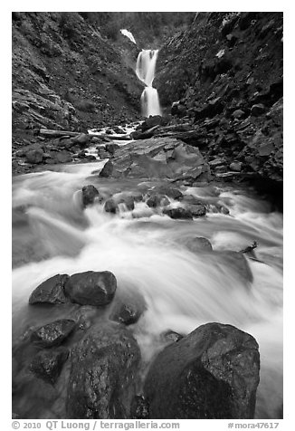 Water flowing over boulders from waterfall. Mount Rainier National Park (black and white)