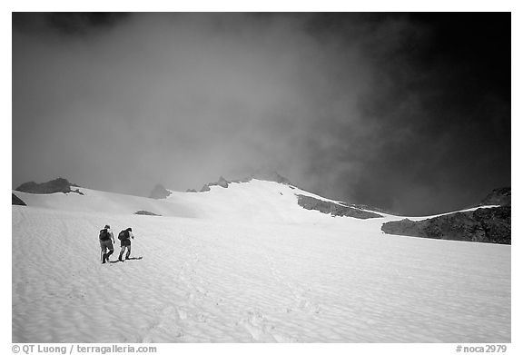 Mountaineers climbing a snow field on Sahale Peak,  North Cascades National Park.  (black and white)
