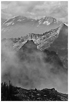 Peaks partly obscured by clouds, North Cascades National Park. Washington, USA. (black and white)