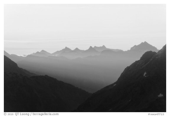 First sunrays lighting peaks above Cascade Pass, North Cascades National Park.  (black and white)