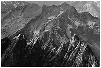 Steep forested spires in dabbled light, North Cascades National Park. Washington, USA. (black and white)