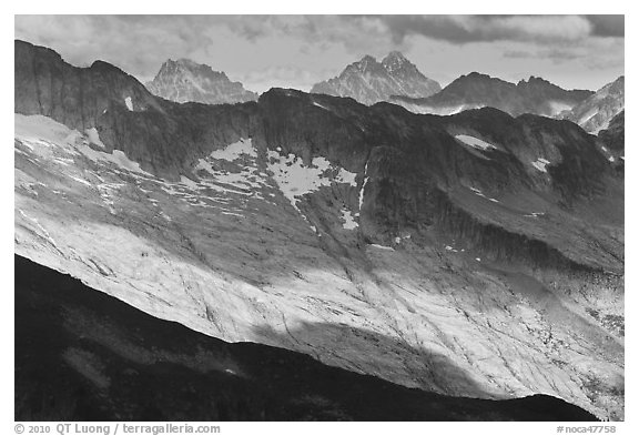 Distant peaks in dabbled afternoon light, North Cascades National Park.  (black and white)
