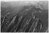 Steep forested spires in foggy light, North Cascades National Park.  ( black and white)