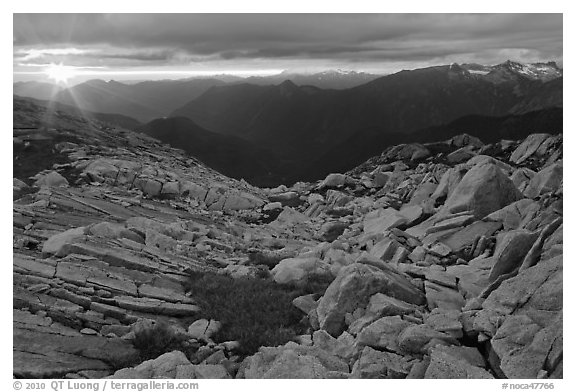 Last rays of sunset color rocks in alpine basin, North Cascades National Park.  (black and white)