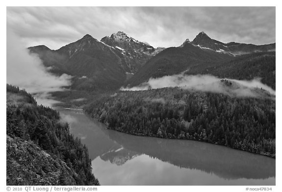 Colonial Peak and Pyramid Peak above Diablo Lake on rainy evening, North Cascades National Park Service Complex. Washington, USA.