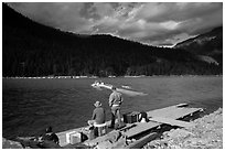 Guests waiting for ride across lake to Ross Lake resort, North Cascades National Park Service Complex.  ( black and white)