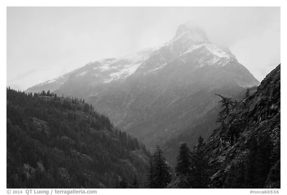 Snow-capped jagged peak in clouds, North Cascades National Park.  (black and white)