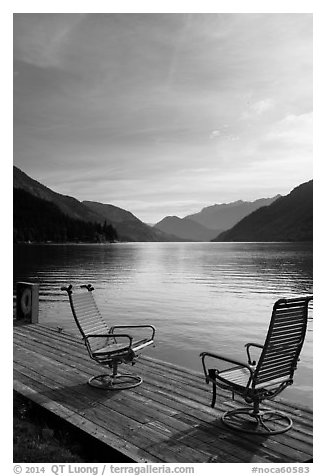 Two chairs on the shore of Lake Chelan, Stehekin, North Cascades National Park Service Complex.  (black and white)