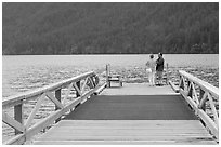 Couple on Pier, Crescent Lake. Olympic National Park, Washington, USA. (black and white)