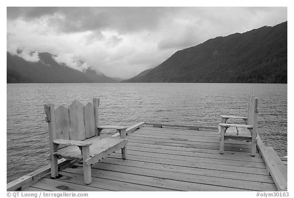 Two chairs on pier, Crescent Lake. Olympic National Park, Washington, USA.