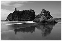 Sea stacks reflected on wet beach, Ruby Beach. Olympic National Park, Washington, USA. (black and white)