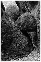 Boulder wedged in slot, Balconies Caves. Pinnacles National Park, California, USA. (black and white)