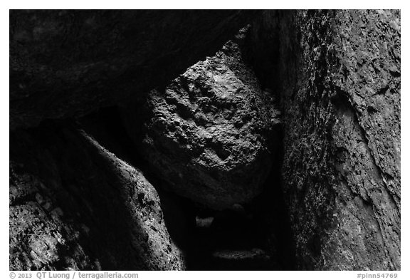 Dark passage with wedged boulder, Balconies Cave. Pinnacles National Park, California, USA.