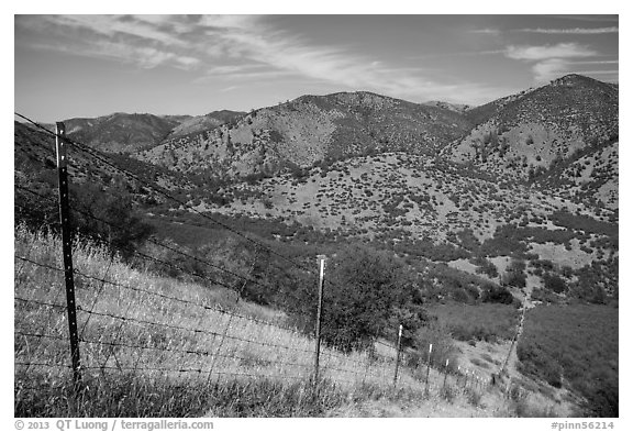 Boundary fence along steep hill. Pinnacles National Park, California, USA.