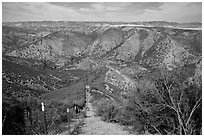 Steep hill and pig exclusion fence. Pinnacles National Park ( black and white)