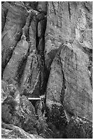 Footbridge at Tunnel exit dwarfed by rock towers. Pinnacles National Park ( black and white)