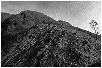 Rock with knobs and cobbles and sky with cloudlets. Pinnacles National Park ( black and white)