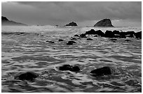 Turbulent waters, stormy dusk, False Klamath Cove. Redwood National Park, California, USA. (black and white)