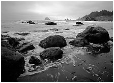 Sand, boulders and surf, Hidden Beach. Redwood National Park, California, USA. (black and white)