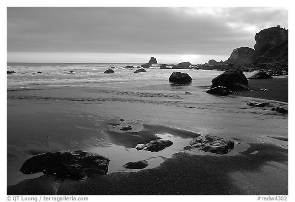 Stream, beach, and ocean at sunset, False Klamath cove. Redwood National Park, California, USA.