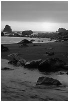 Stream on beach at sunset, False Klamath cove. Redwood National Park, California, USA. (black and white)