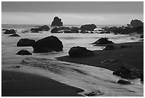 Stream, rocks, and ocean at dusk, False Klamath cove. Redwood National Park, California, USA. (black and white)