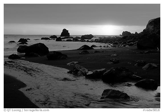 Stream reaches Pacific, False Klamath cove, sunset. Redwood National Park, California, USA.