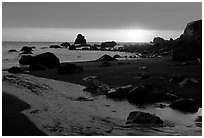 Stream reaches Pacific, False Klamath cove, sunset. Redwood National Park, California, USA. (black and white)