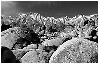 Volcanic boulders in Alabama hills and Sierras, morning. Sequoia National Park ( black and white)
