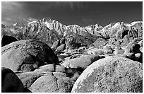 Volcanic boulders in Alabama hills and Sierras, morning. Sequoia National Park, California, USA. (black and white)