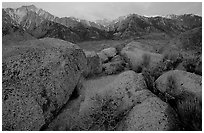 Volcanic boulders in Alabama hills and Sierras, sunrise. Sequoia National Park ( black and white)