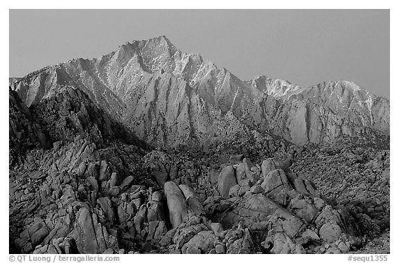 Volcanic boulders in Alabama hills and Lone Pine Peak, dawn. Sequoia National Park, California, USA.