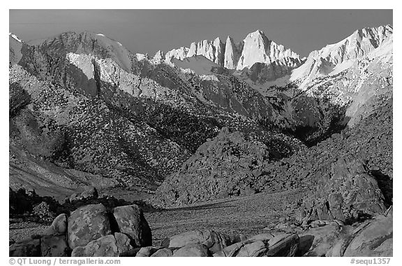 Volcanic boulders in Alabama hills and Mt Whitney, sunrise. Sequoia National Park, California, USA.