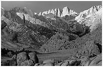 Volcanic boulders in Alabama hills and Mt Whitney, sunrise. Sequoia National Park, California, USA. (black and white)