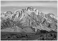 Volcanic boulders in Alabama hills and Lone Pine Peak, sunrise. Sequoia National Park, California, USA. (black and white)