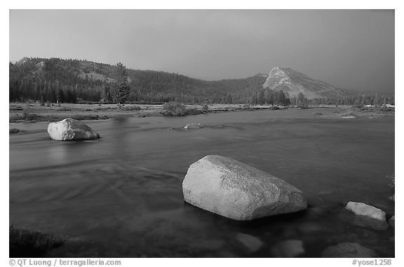 Tuolumne Meadows, Lembert Dome, and rainbow, storm clearing at sunset. Yosemite National Park, California, USA.